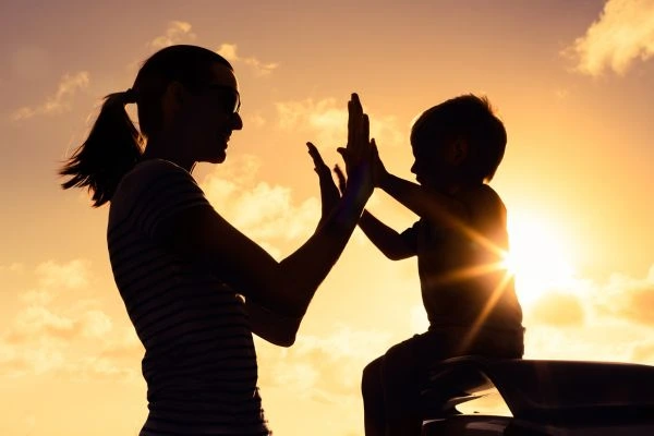 Image of happy mother and child after resolving child arrangements Bath